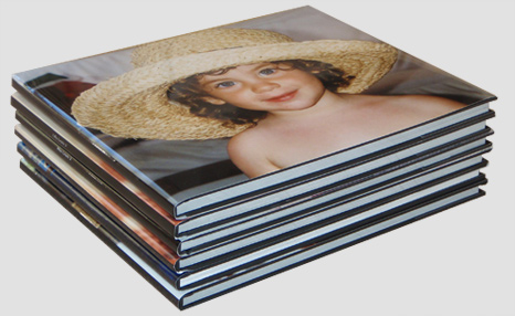 A stack of books with full size glossy image on book jacket.
